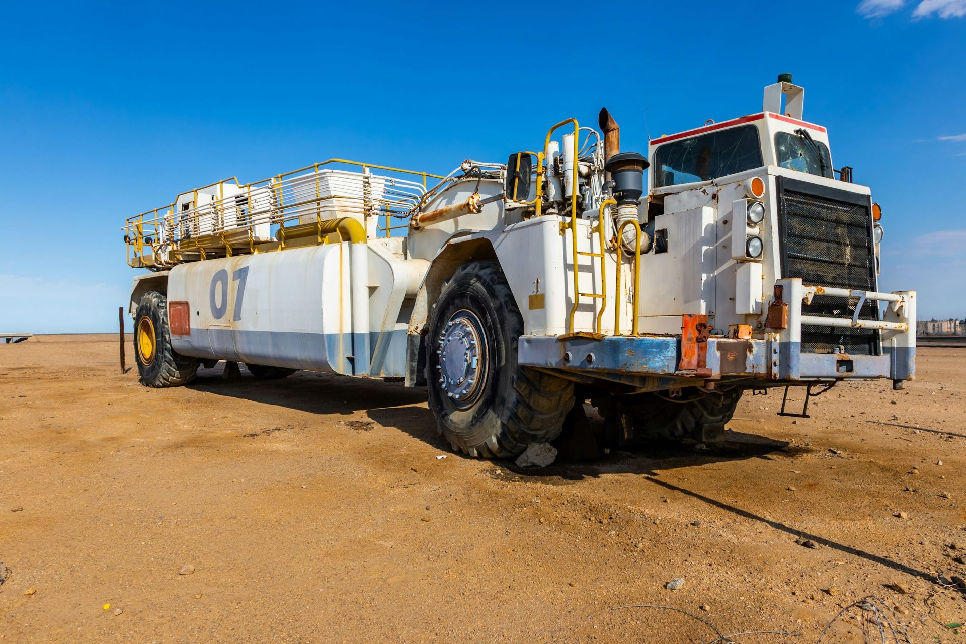 Heavy utility vehicle on a sandy work site